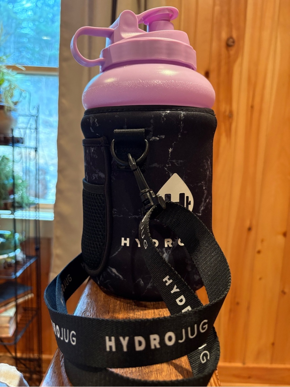 HydroJug Classic water with a matching HydroJug Neoprene Sleeve pink/grey